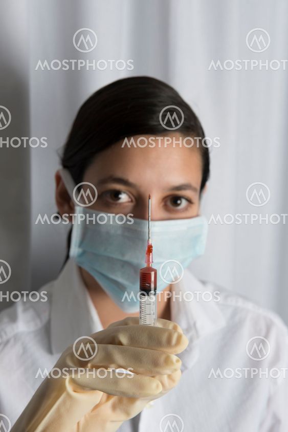 Beautiful women holding syringe