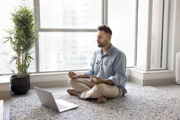 Calm concentrated young Hispanic yogi man attending...