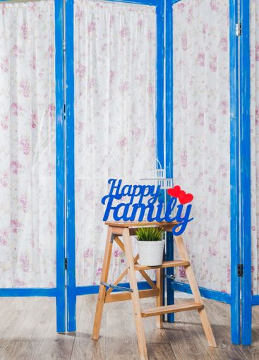 Blue wooden decorating screen with textile panels