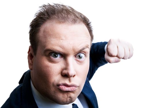 man dressed understands fist