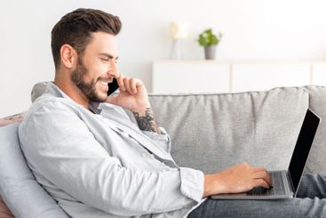 Home office concept. Millennial businessman talking on...