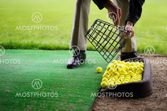 Golf balls pouring out of basket