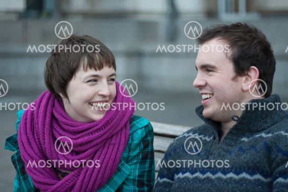 Laughing young couple enjoying winter weather