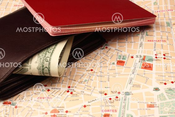 Wallet and passport on map background