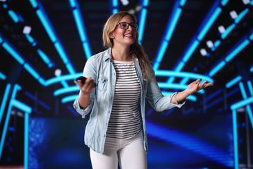 Speaker On Stage At Event Talking