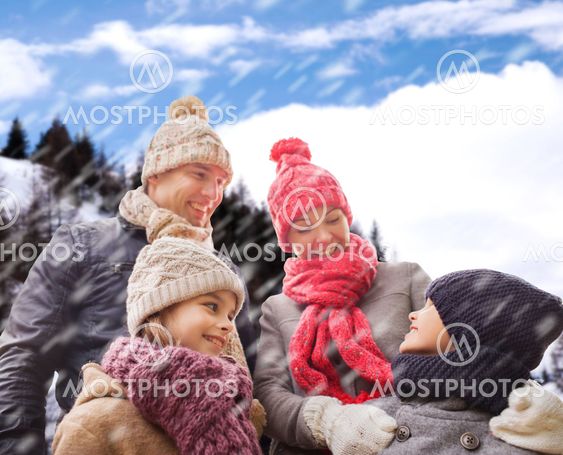happy family in winter clothes outdoors