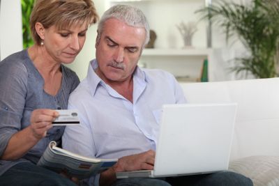 a mature couple purchasing on internet