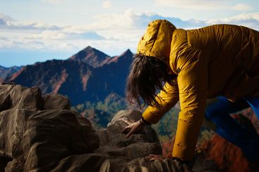 Foolish hiker tripping and losing balance on the rocky...