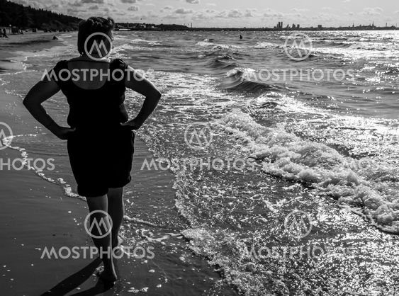 Mature blonde enjoying the sea