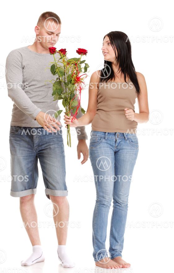 Attractive young couple gift rose in hand isolated
