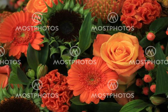 Mixed orange wedding arrangement