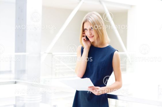 business woman holding reports. Copy space