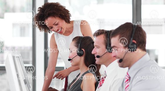 Delighted female manager with her sale representative team