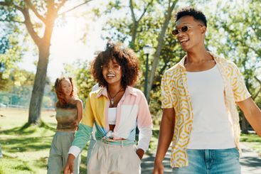 Happy, walking and couple in park on weekend to relax...