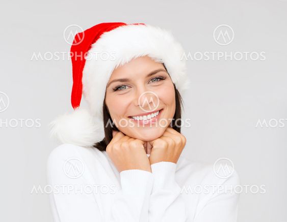 smiling woman in santa helper hat