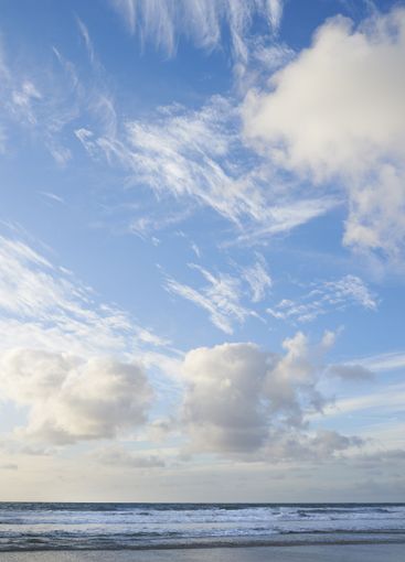 Beach, shoreline or tourism with clouds, sky or paradise...