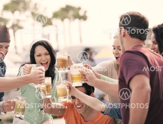 Young People toasting with Beer