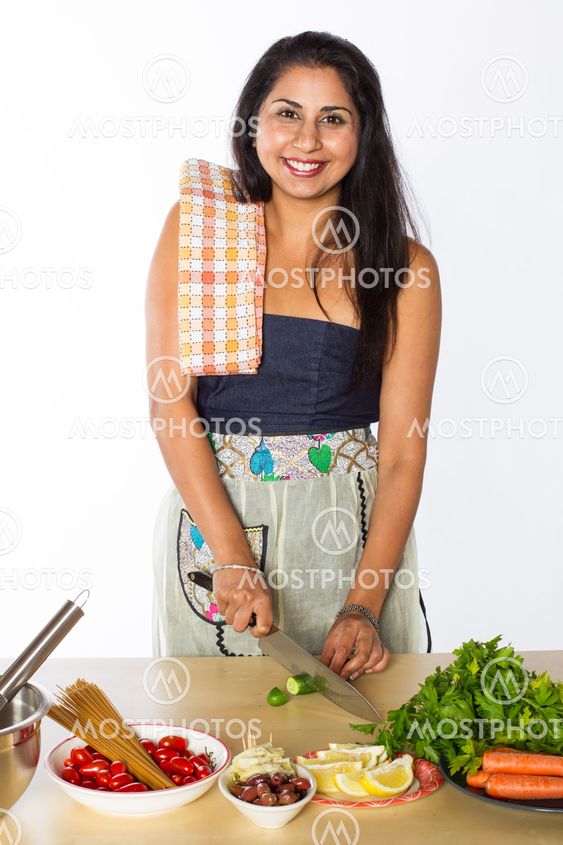 Smiling Indian Woman Cutting Vegetables
