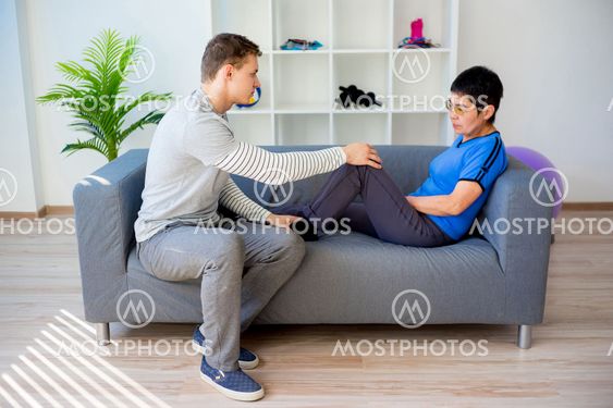 Physiotherapist working with patient
