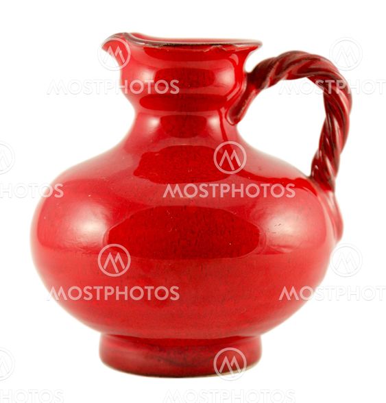 red ceramic old jug with handle isolated on white
