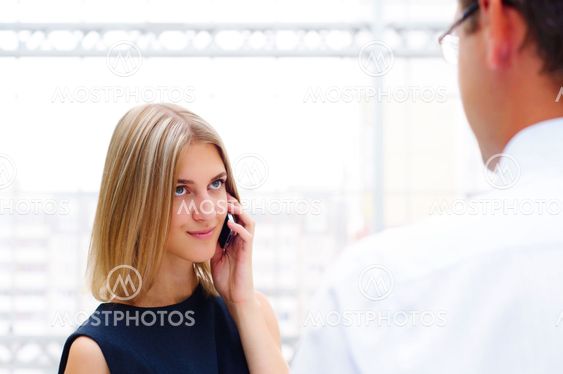business man and business woman discuss reports