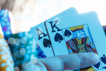 Poker game set of cards and chips close up