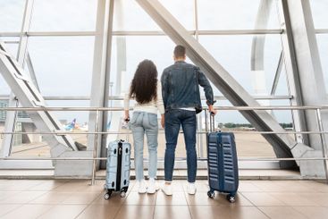 Journey Together. Rear View Of Young Couple Waiting For...