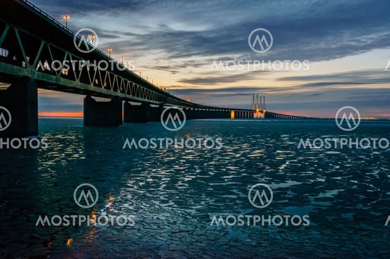 The Øresund Bridge reflected in icy waters