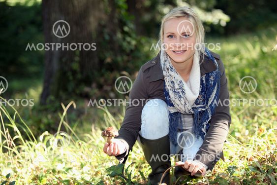 Woman picking mushrooms