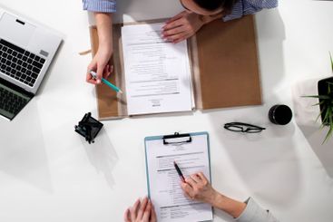 Businesswoman conducting recruiting interview in office,...