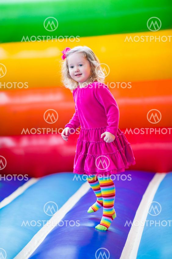 Little girl jumping and bouncing