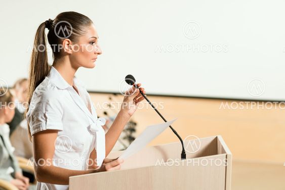 Portrait of a business woman with microphone