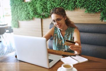 Cafe, typing and businesswoman with laptop for credit...