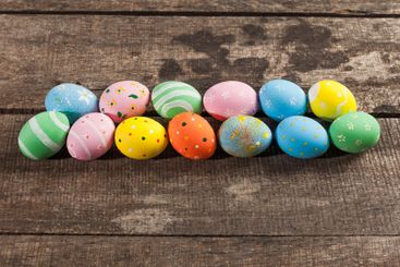 Vintage colorful easter eggs on wood table background