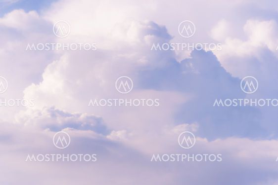 Soft pink clouds in sunset sky
