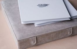 There is a photo book wrapped in a gray cloth in the box....