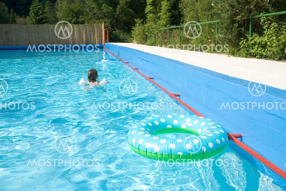 child is swimming with safety-wings