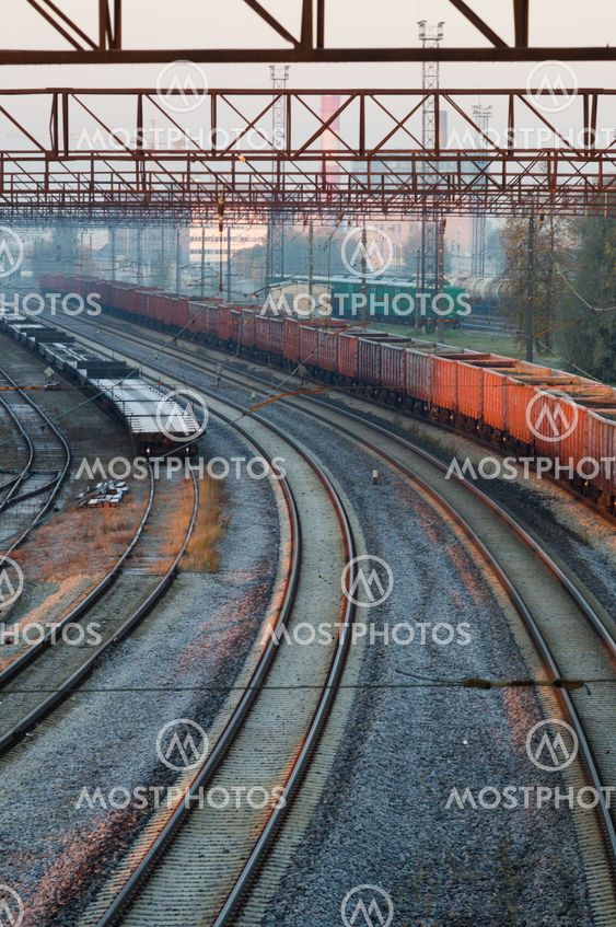 Turning railway tracks on cargo station at frosty morning