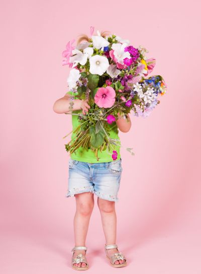 Toddler girl with flowers