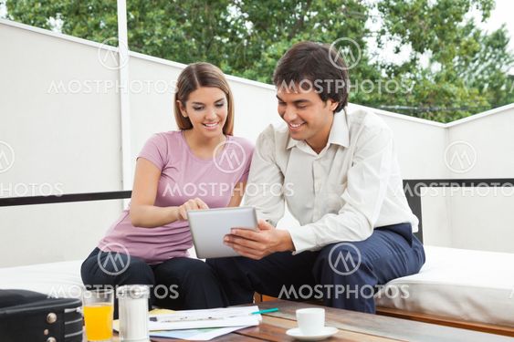 Architect Discussing With Female Client