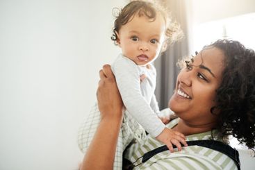 Love, happy and mother with her baby in his nursery...