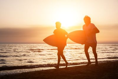 Two Boys with Surf Boards at Sunset
