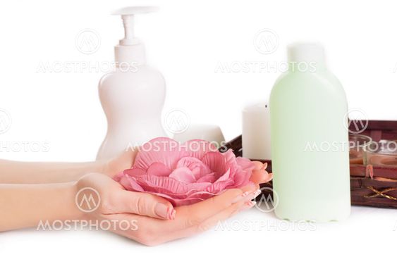 Woman hands with manicure and hand care products