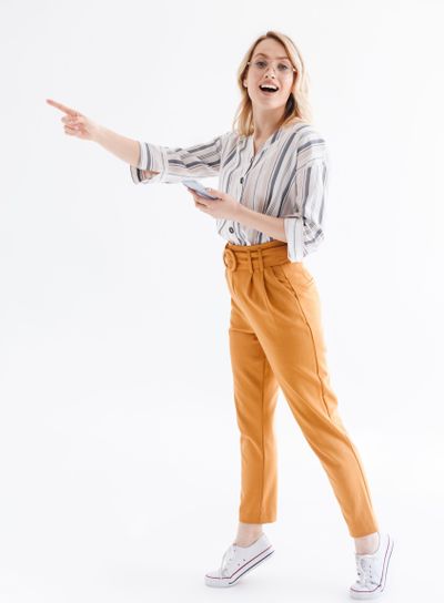 Full length photo of surprised european woman wearing...