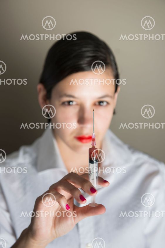 Beautiful women holding syringe