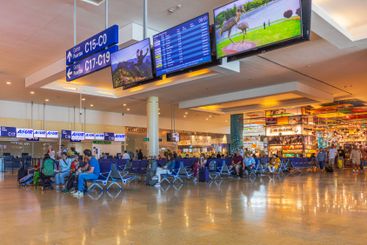 Busy waiting area in International Airport with travelers 