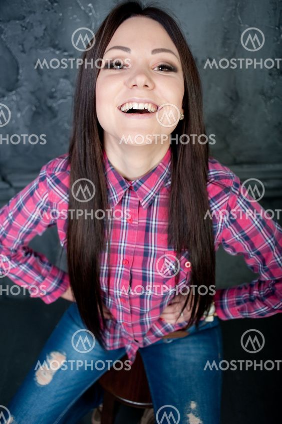 The cheerful young girl poses