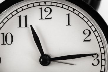 Close up of a black vintage alarm clock