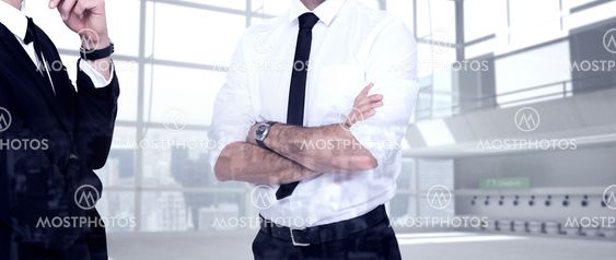 Composite image of smiling businessman with arms crossed