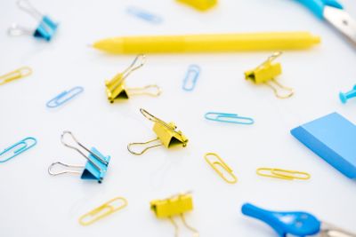 selective focus of colourful paper clips and other...